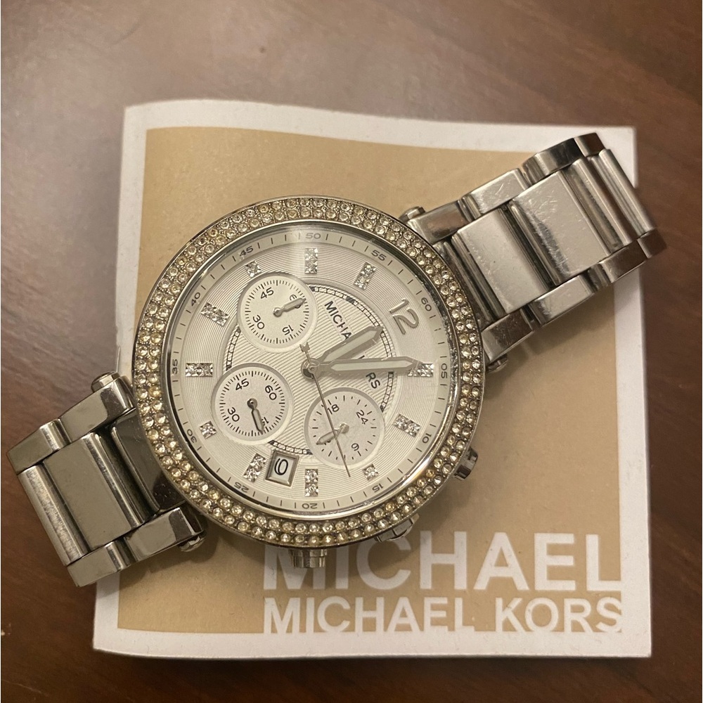 Michael kors silver with diamonds around white face watch